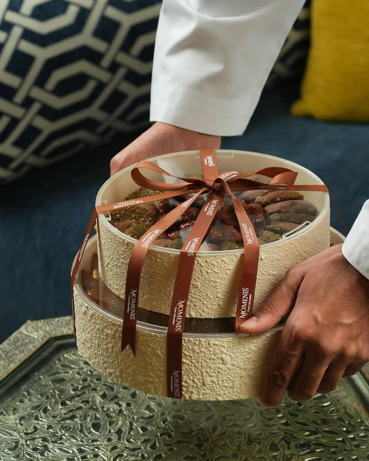 Round chocolate gift box with elegant ribbon – crafted to impress.
